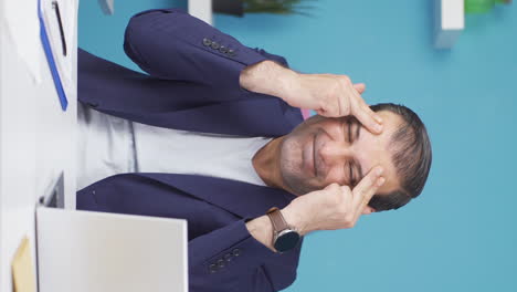 Vertical-video-of-Businessman-suffering-from-migraine.